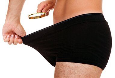 gizonak bere zakilaren tamainari begiratzen dio